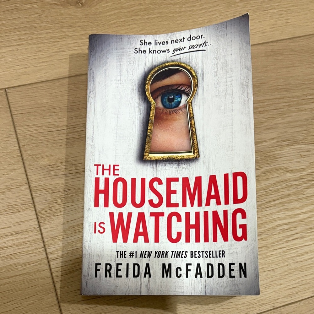 The Housemaid Is Watching by Freida McFadden - White & Red Paperback